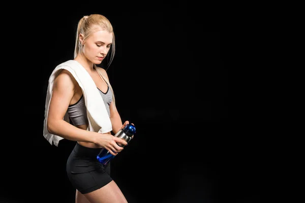 Sportswoman holding bottle — Stock Photo, Image