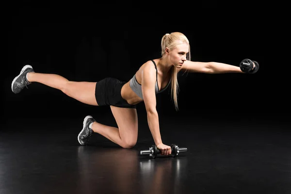 Woman exercising with dumbbells — Stock Photo, Image