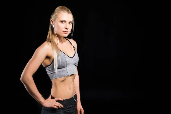 Mujer deportiva con auriculares — Foto de Stock