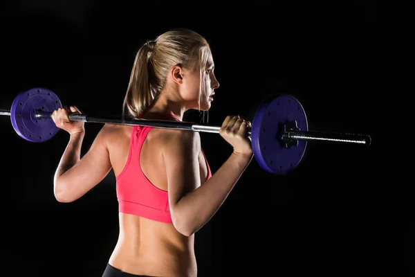 Mujer haciendo ejercicio con barra — Foto de Stock