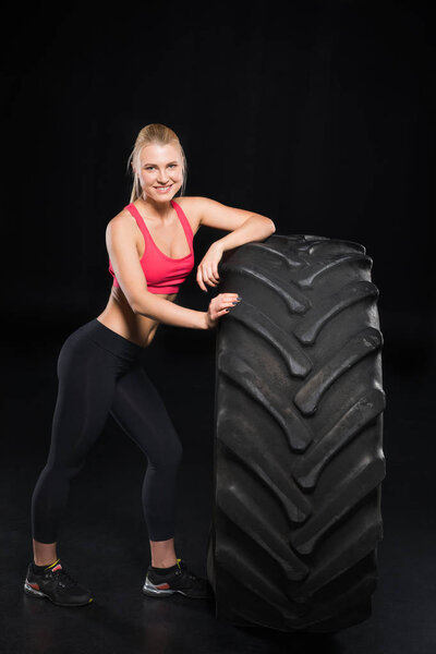 sporty woman with tire