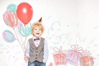 boy in cone hat with balloons clipart