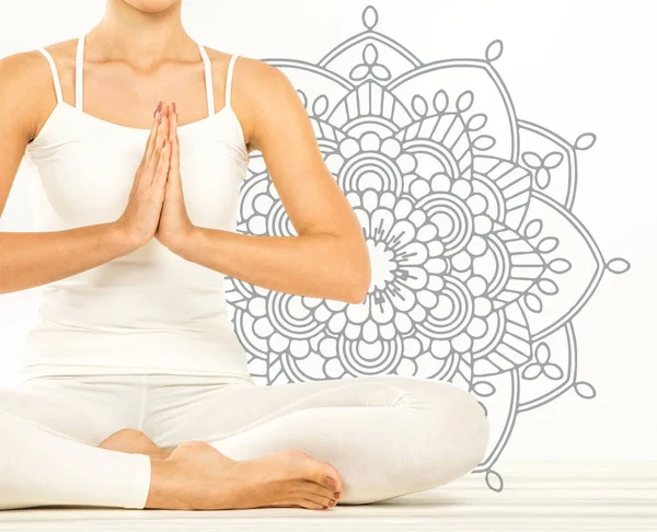 Woman sitting in lotus position — Stock Photo, Image