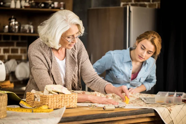 Tailors working with fabric — Stock Photo