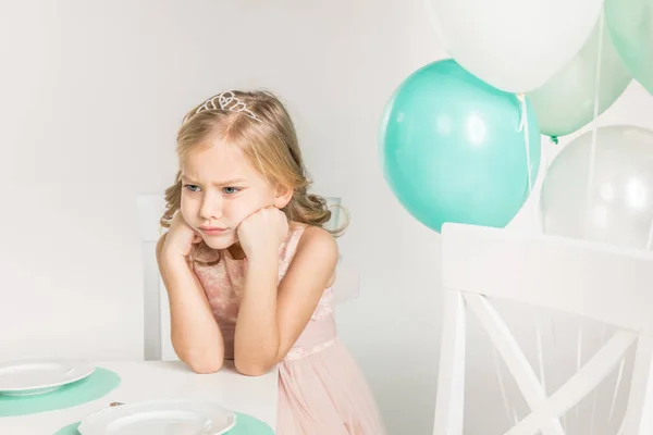 Adorable girl at birthday table — Stock Photo