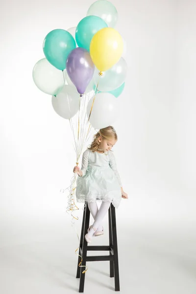 Girl with air balloons — Stock Photo