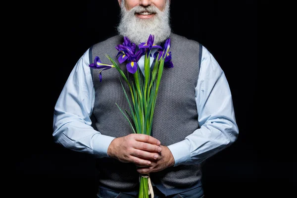 Seniorchef mit Blumen — Stockfoto