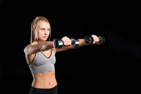 Woman exercising with dumbbells — Stock Photo