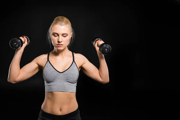 Woman exercising with dumbbells — Stock Photo