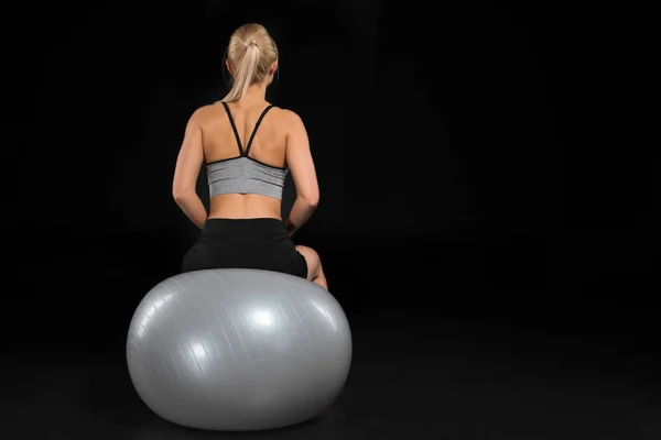 Young woman on fitness ball — Stock Photo