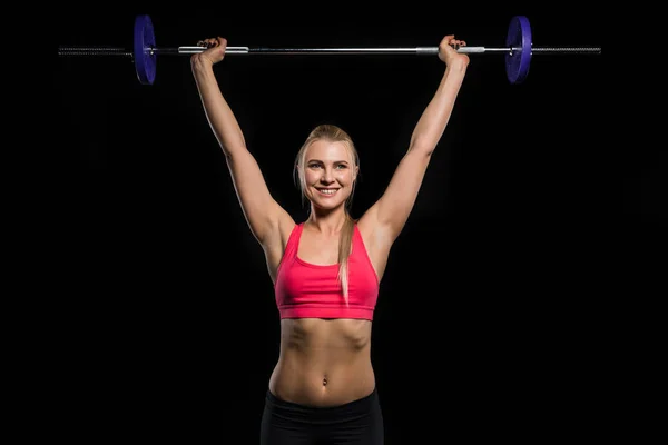 Mujer haciendo ejercicio con barra - foto de stock