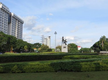 JAKARTA, INDONESIA - December 2, 2017: The Heroes Monument or The Farmers Monument (Indonesian: Patung Pahlawan or Tugu Tani) clipart