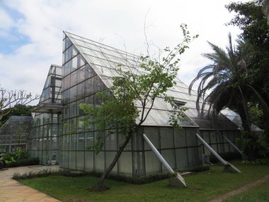 JAKARTA, INDONESIA - December 3, 2017: Glass houses at Taman Menteng (Menteng Park).