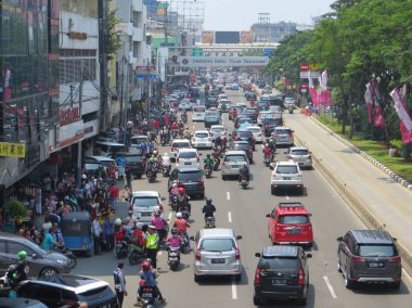 JAKARTA, INDONESIA - March 4, 2018: Congested traffic on Jalan Hayam Wuruk, Jakarta's chinatown.