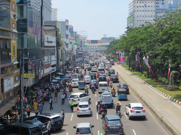JAKARTA, INDONESIA - March 4, 2018: Congested traffic on Jalan Hayam Wuruk, Jakarta's chinatown.
