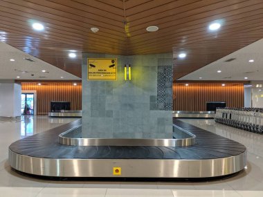 Denpasar, Indonesia - September 17, 2019: Baggage conveyor at the Domestic Arrival Terminal of Ngurah Rai International Airport.