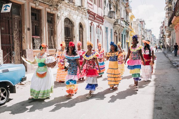 Havana, Cuba - January 22, 2017: colorful dressed women at carnival in old town