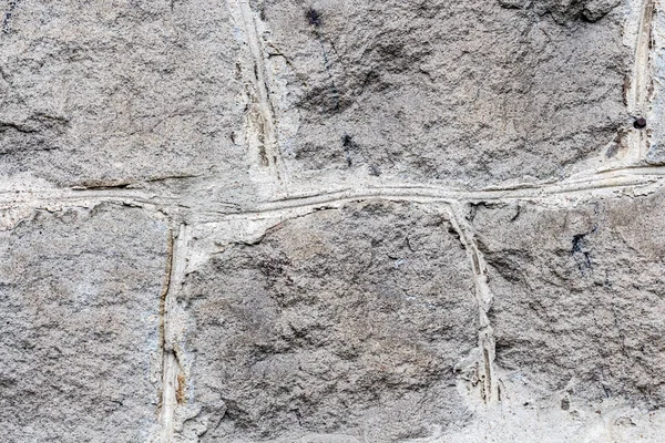 Eski taş duvar dokusunun arka planı. — Stok fotoğraf