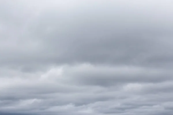 Low dark gray clouds cover the whole sky