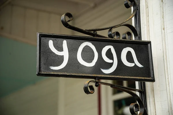 Closeup of a yoga studio sign on the the sreet in New England — Stock Photo, Image
