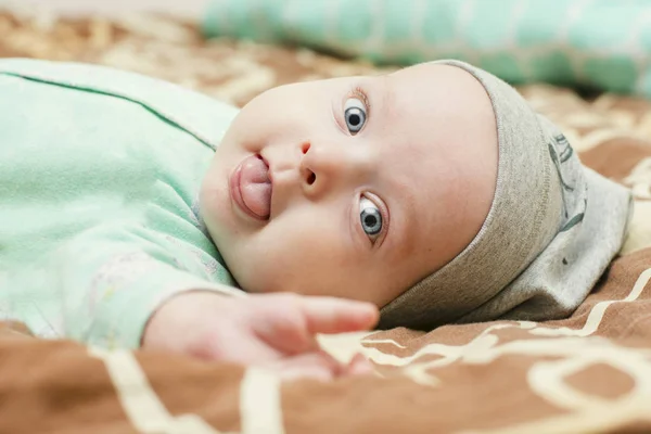 4 month kid shows language — Stock Photo, Image