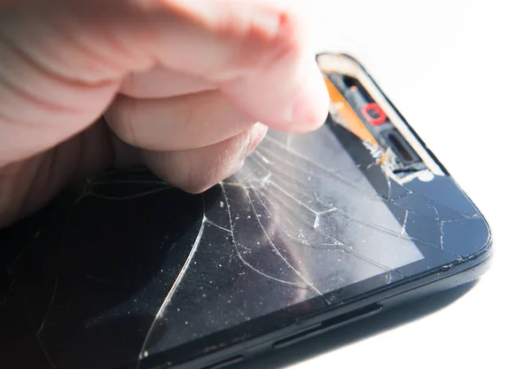 Punch in the screen of the phone — Stock Photo, Image