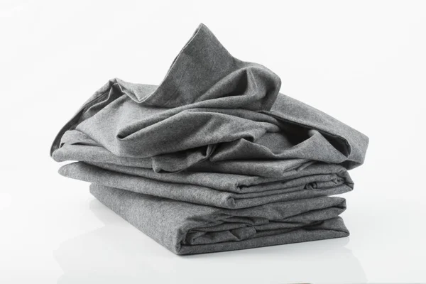 Ropa de cama flanell gris sobre fondo blanco —  Fotos de Stock