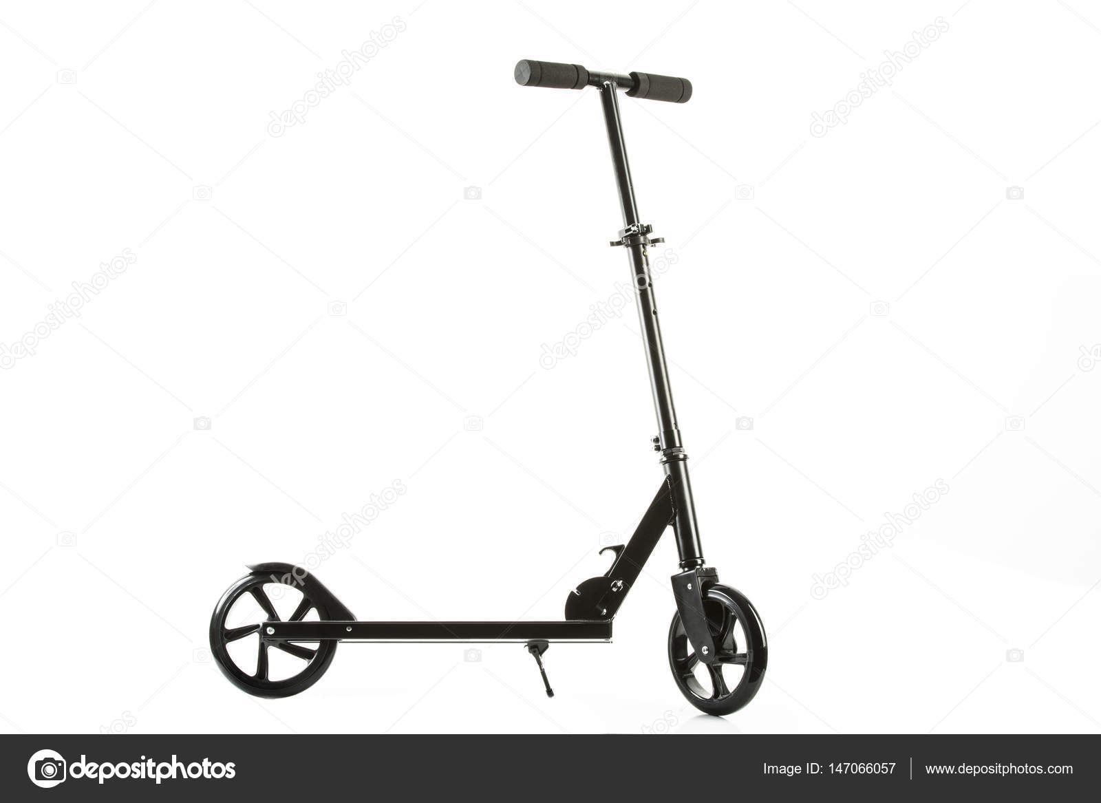 Black scooter footboard with steering handle Stock Photo by ©MPHOTO2 147066057