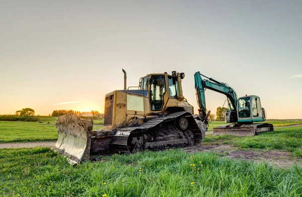 The excavator and bulldozer. — Stock Photo, Image