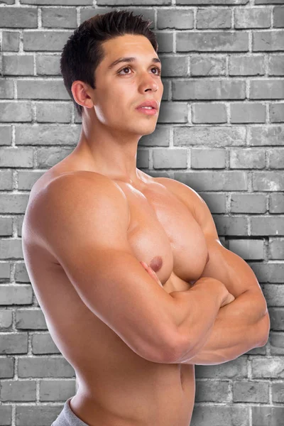 Culturista musculación músculos fuerte pared muscular joven —  Fotos de Stock