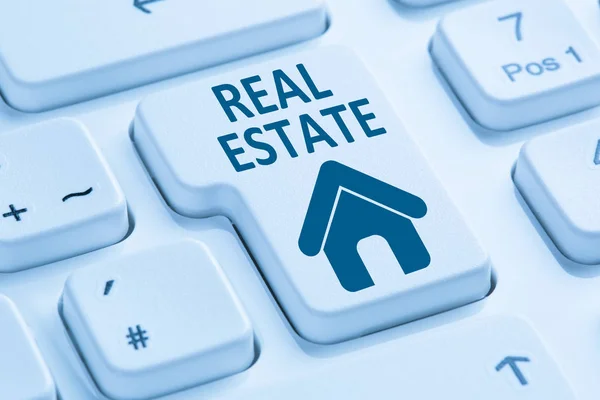 Venta de compra de bienes raíces icono de la casa en línea azul ordenador keyboa — Foto de Stock