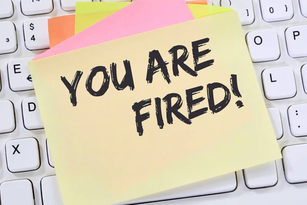 You are fired employee losing jobs, job working unemployed business concept note paper computer keyboard