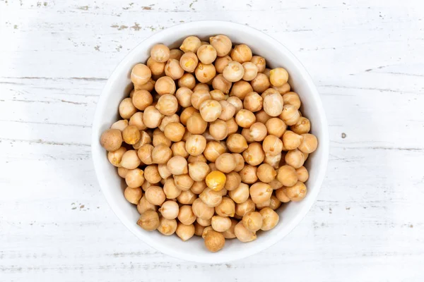 Chickpeas peas raw from above bowl wooden board — Stock Photo, Image