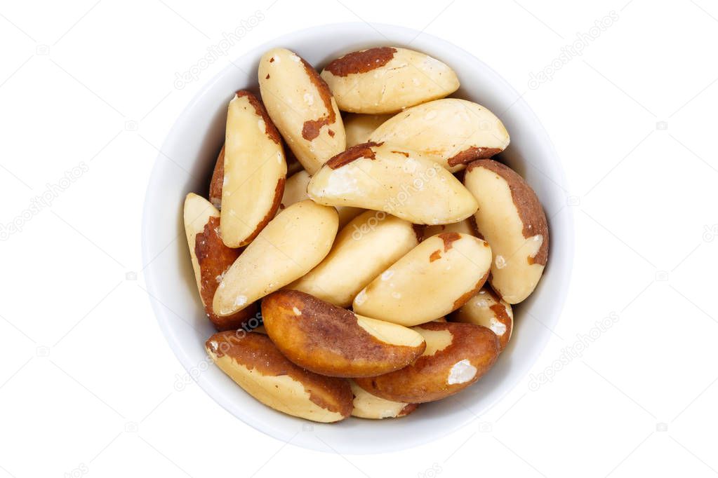 Brazil nut nuts from above bowl isolated on white