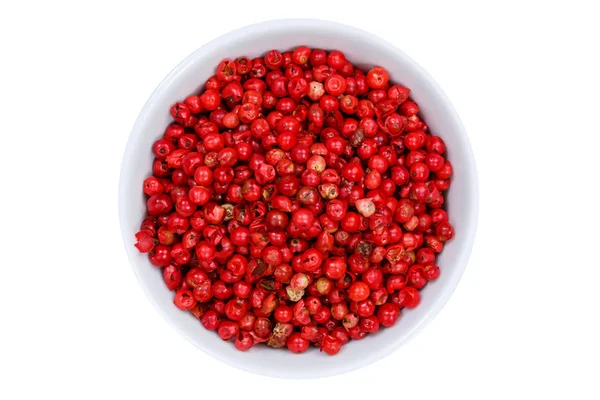 Red peppercorns pepper peppercorn from above bowl isolated on wh — Stock Photo, Image
