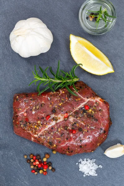 Meat raw beef steak portrait format from above slate — Stock Photo, Image