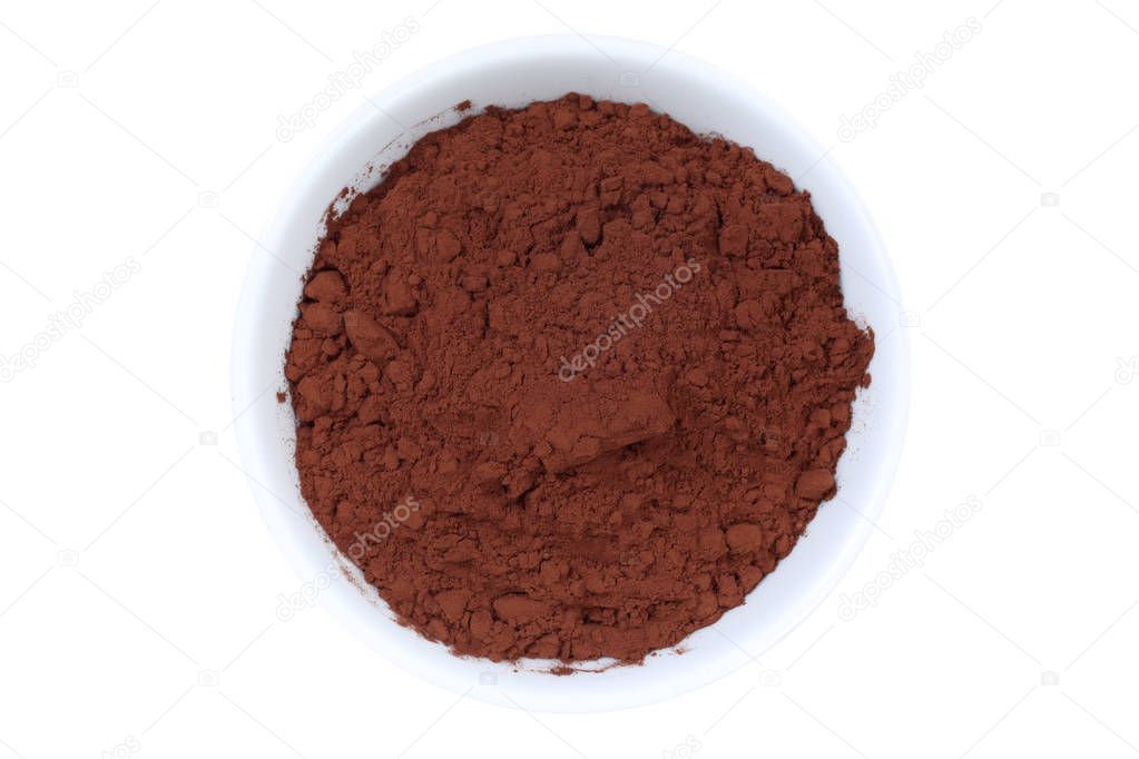 Cocoa powder from above bowl isolated on white