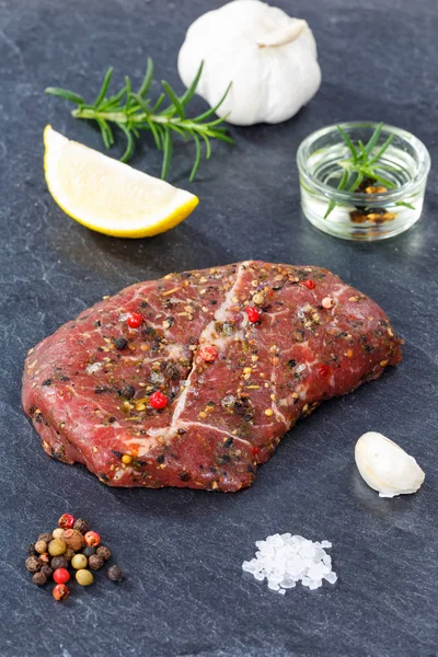 Meat raw beef steak portrait format on slate — Stock Photo, Image