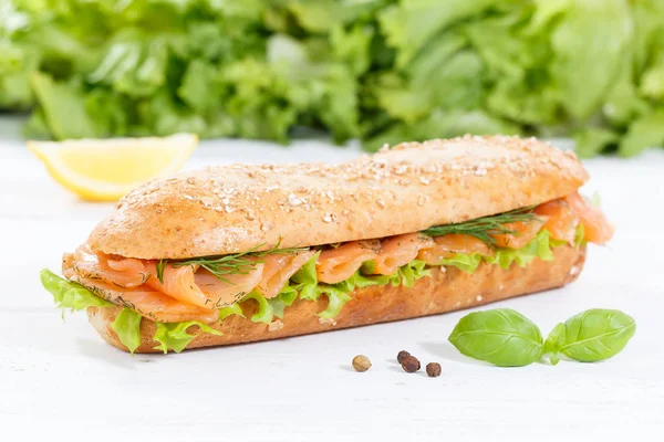 Sub sandwich whole grains baguette with smoked salmon fish on wo — Stock Photo, Image