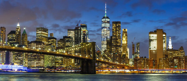 New York City skyline night Manhattan panoramic view Brooklyn Bridge World Trade Center WTC