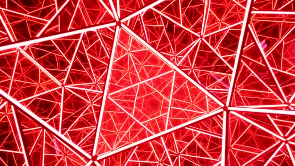 Kaleidoscopic geometric structure made of glass triangle cells and illuminated with bright red light — Stock Video