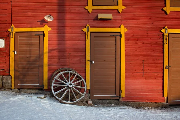 vintage old wooden door and wooden wheel 