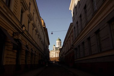 Cityscape with hard shadows before sunset