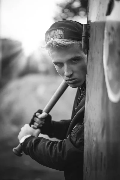 Hooligan with the baseball bat in hands — Stock Photo, Image