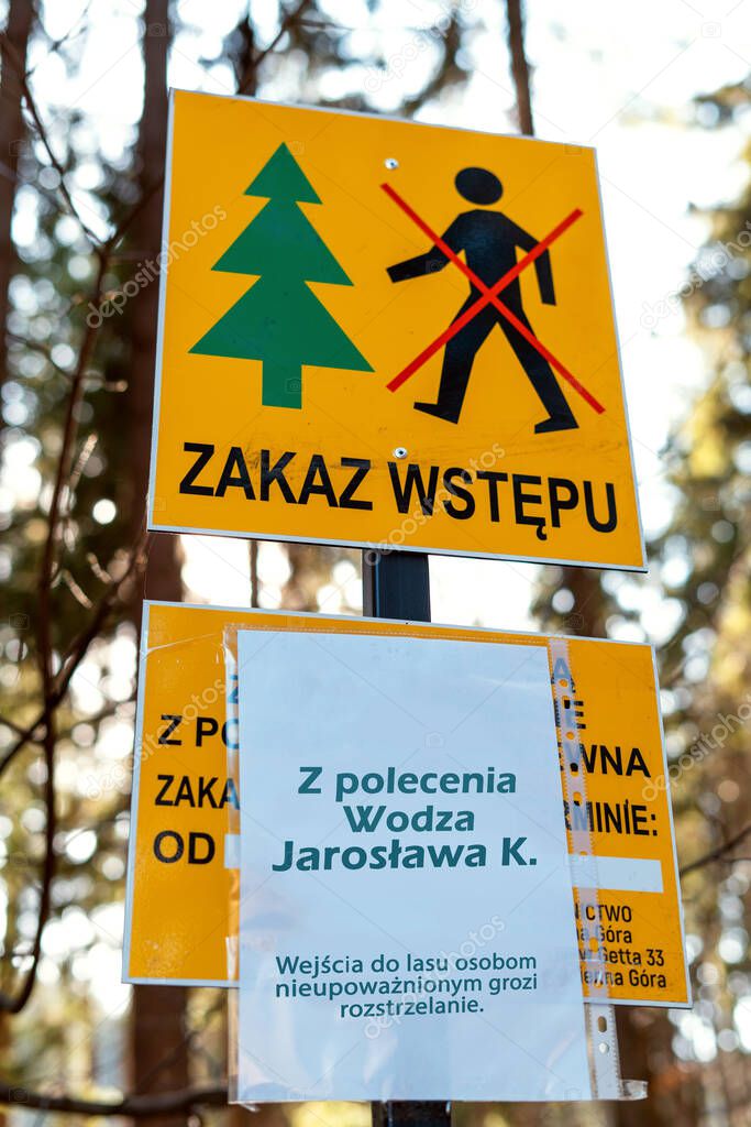 Return of communism in Poland. Information plate with a sign prohibiting entry into the forest under threat of being shot.  PIS violates human rights during the coronavirus epidemic.