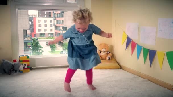 Happy hyperactive toddler child move fast in front of camera — Stock Video