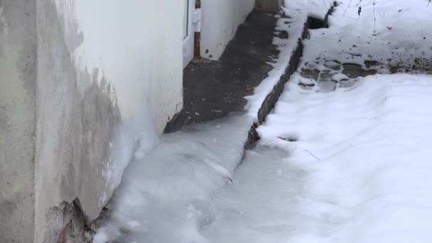 Ice pile frozen under recuperator heat pump system on house wall in winter. 4K — Stock Video