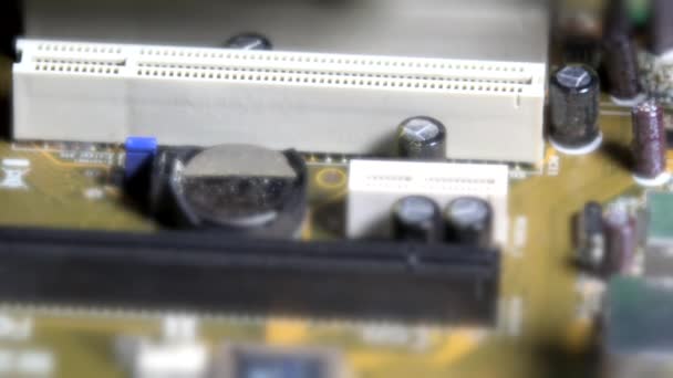 Technician hands with gloves inserting pci card to computer main board — Stock Video