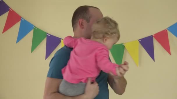 Father dance spin around with small daughter on hands indoor. 4K — Stock Video