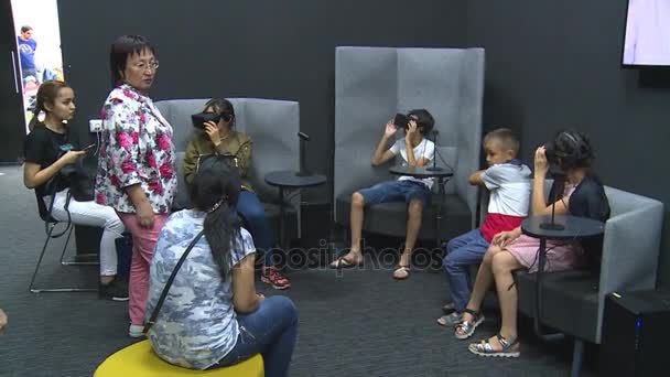 Kazakh people with children wearing virtual reality 3D VR headset glasses — Stock Video